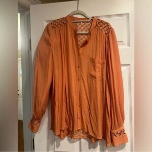 Free People long sleeve button down with beautiful detail on sleeves and back.